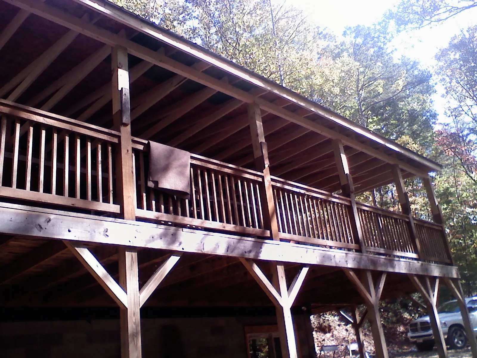 Timber framing under a new elevated porch and deck — Roof Leak Repair in Cadillac by Roofing Brothers